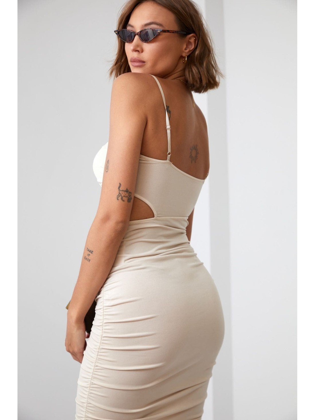 Sensual mini dress with a cutout, beige 22616 - Online store - Boutique